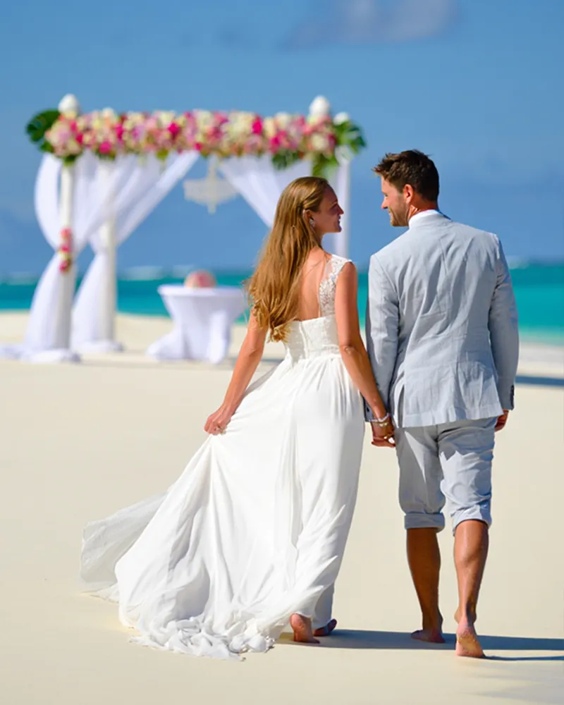 Couole wlking up to the wedding pavillion at Jambiani neach