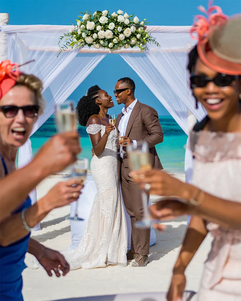 Wedding guests celebrate couple at Paje beach