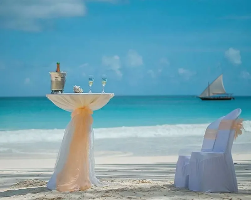 The Coconut Wedding Package setup on a white sand beach in Zanzibar.