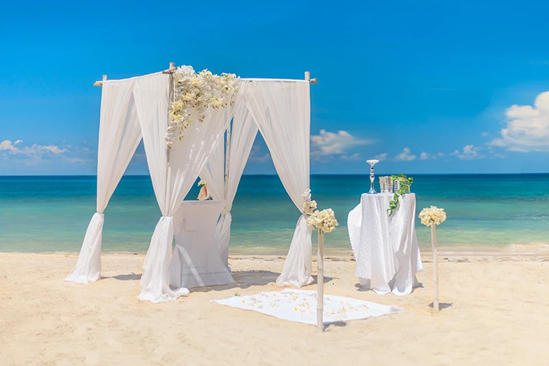 Intimate beach setup for a symbolic Zanzibar wedding ceremony.