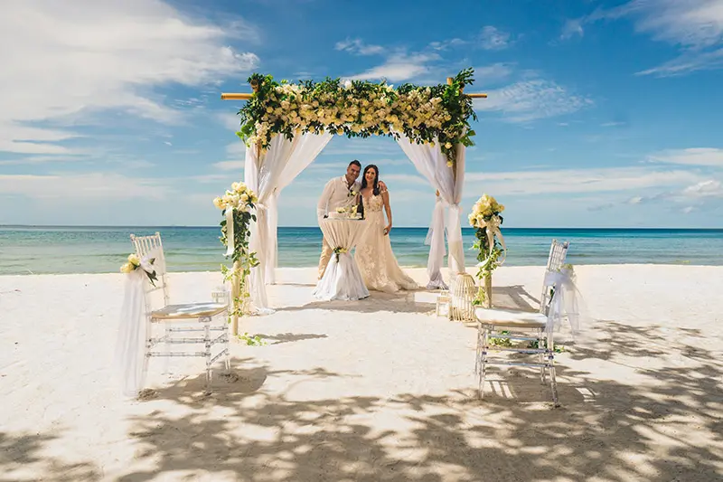 Tropical-themed wedding decorations and floral decorated pavilion in Zanzibar.